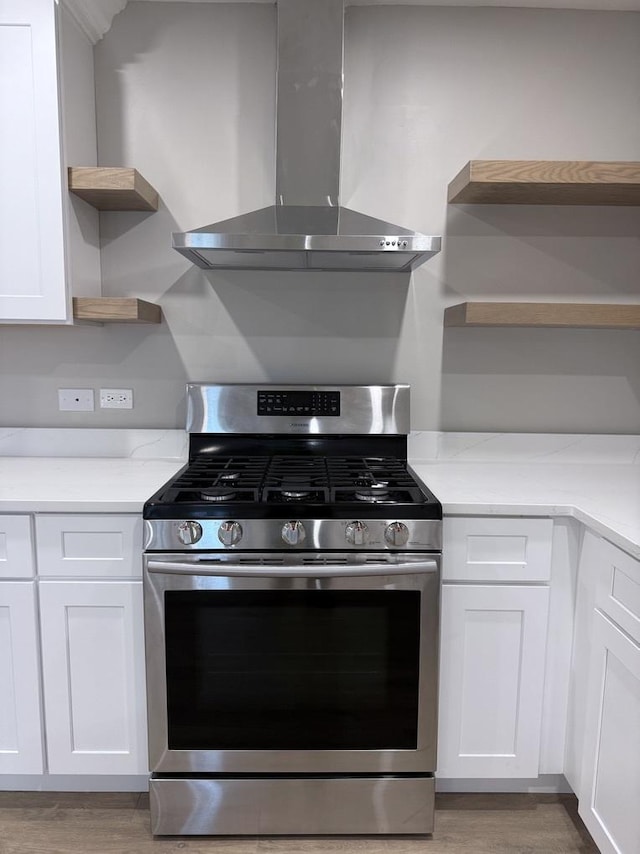4819 W 109th St Unit 204, Oak Lawn, IL 60453 - kitchen featuring gas stove, open shelves, wall chimney range hood, white cabinets, and light wood finished floors