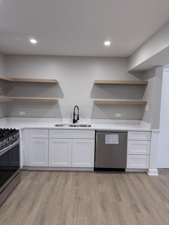 4819 W 109th St Unit 204, Oak Lawn, IL 60453 - kitchen with open shelves, appliances with stainless steel finishes, white cabinets, light wood-style floors, and recessed lighting