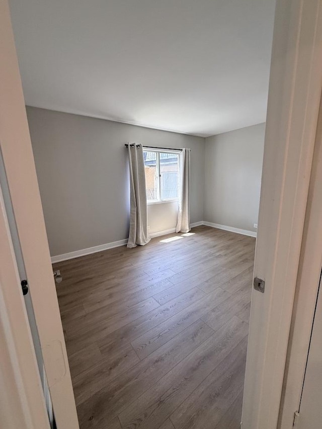 4819 W 109th St Unit 204, Oak Lawn, IL 60453 - unfurnished room with wood finished floors and baseboards