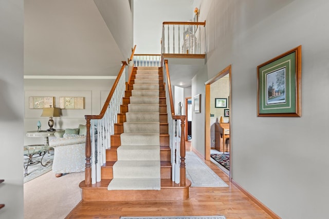 3063 Wedgewood Dr, Dekalb, IL 60115 - stairs featuring wood finished floors and a towering ceiling