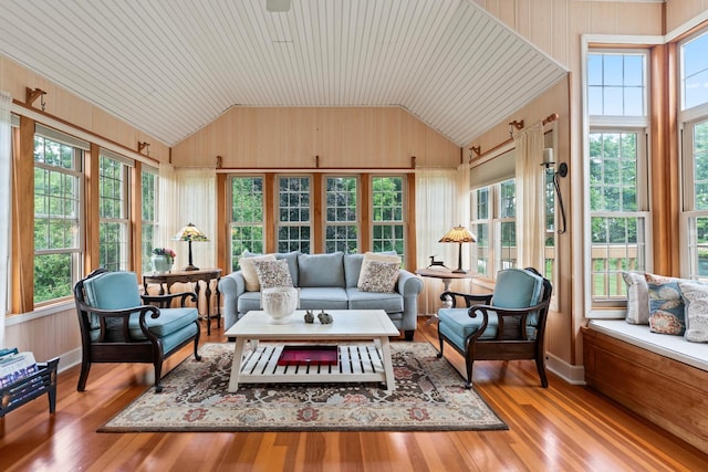 3063 Wedgewood Dr, Dekalb, IL 60115 - sunroom / solarium with vaulted ceiling, wood finished floors, healthy amount of natural light, a deck, and wooden walls