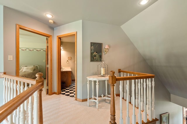 3063 Wedgewood Dr, Dekalb, IL 60115 - corridor with an upstairs landing, carpet flooring, vaulted ceiling, and recessed lighting