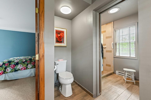 3063 Wedgewood Dr, Dekalb, IL 60115 - full bath with a baseboard heating unit, a shower stall, and wood finished floors
