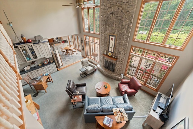 3063 Wedgewood Dr, Dekalb, IL 60115 - living room featuring a high ceiling, a fireplace, and a ceiling fan