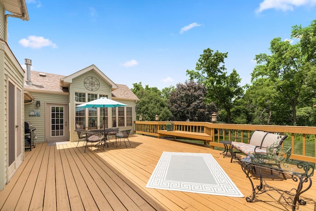 3063 Wedgewood Dr, Dekalb, IL 60115 - wooden terrace with outdoor dining space, a grill, and view of scattered trees