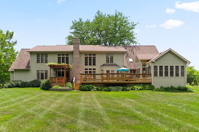 3063 Wedgewood Dr, Dekalb, IL 60115 - rear view of house with a wooden deck, a chimney, and a yard