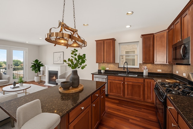 7443 W Irving Park Rd Unit 4E, Chicago, IL 60634 - kitchen with stainless steel appliances, open floor plan, tasteful backsplash, dark wood finished floors, and recessed lighting
