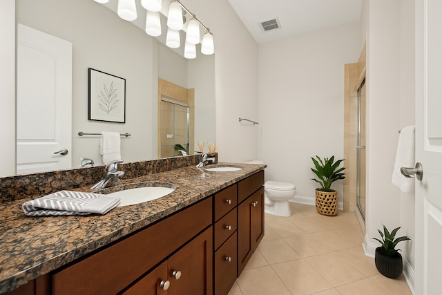 7443 W Irving Park Rd Unit 4E, Chicago, IL 60634 - bathroom featuring a stall shower, double vanity, and tile patterned floors