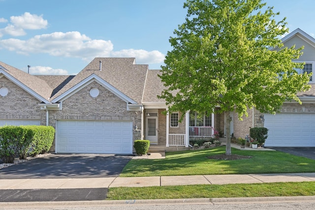 11636 Waterway Ct, Orland Park, IL 60467 - view of front facade with roof with shingles, a front yard, asphalt driveway, a porch, and brick siding