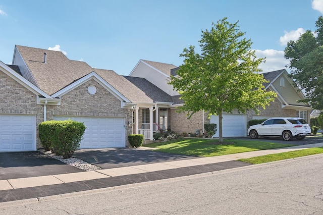 11636 Waterway Ct, Orland Park, IL 60467 - view of front of house with a front lawn, a shingled roof, brick siding, and asphalt driveway