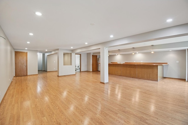 11636 Waterway Ct, Orland Park, IL 60467 - unfurnished living room with recessed lighting, light wood-style floors, and wet bar