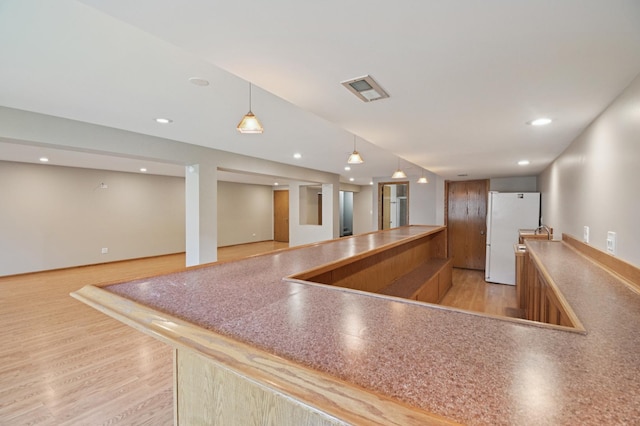 11636 Waterway Ct, Orland Park, IL 60467 - kitchen featuring freestanding refrigerator, pendant lighting, brown cabinets, light wood-style flooring, and open floor plan