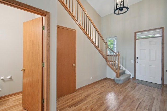 11636 Waterway Ct, Orland Park, IL 60467 - foyer entrance featuring wood finished floors, stairs, a high ceiling, and a chandelier