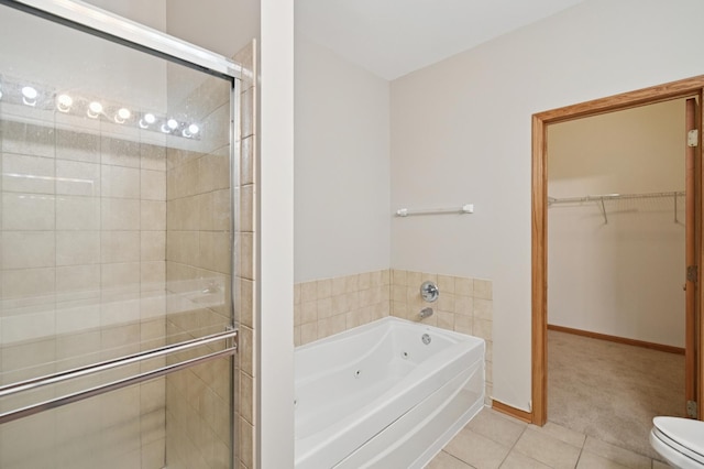 11636 Waterway Ct, Orland Park, IL 60467 - bathroom featuring tile patterned floors, a tub with jets, a stall shower, and a walk in closet