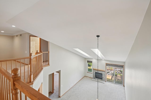 11636 Waterway Ct, Orland Park, IL 60467 - unfurnished living room featuring carpet, a skylight, a stone fireplace, and recessed lighting