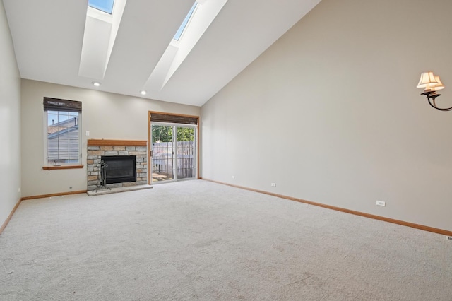 11636 Waterway Ct, Orland Park, IL 60467 - unfurnished living room featuring carpet, a skylight, a fireplace, and high vaulted ceiling