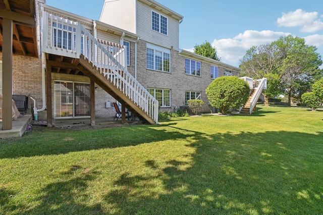 11636 Waterway Ct, Orland Park, IL 60467 - back of property featuring stairway, brick siding, a wooden deck, and a lawn