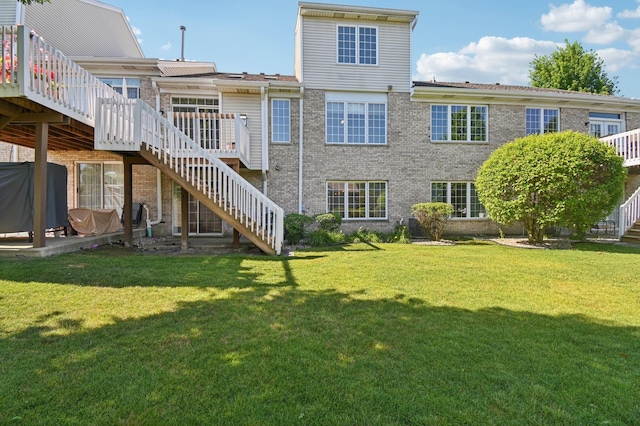 11636 Waterway Ct, Orland Park, IL 60467 - back of property featuring stairs, brick siding, a deck, and a lawn