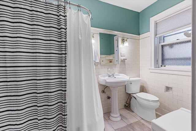 126 N Austin Blvd Unit 2N, Oak Park, IL 60302 - bathroom with tile walls, tile patterned floors, and a shower with curtain