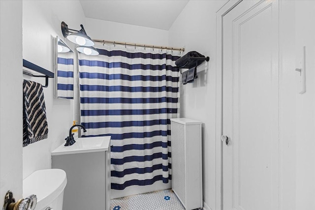 126 N Austin Blvd Unit 2N, Oak Park, IL 60302 - full bathroom with radiator heating unit, vanity, and a shower with shower curtain