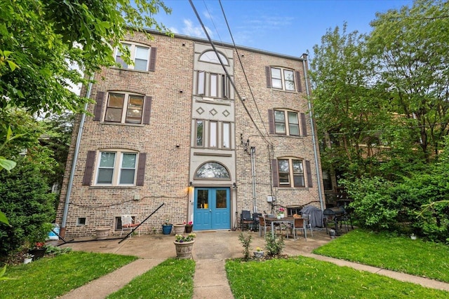 126 N Austin Blvd Unit 2N, Oak Park, IL 60302 - view of front of house with brick siding and a front lawn