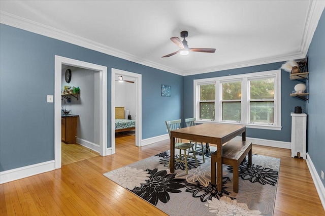 126 N Austin Blvd Unit 2N, Oak Park, IL 60302 - dining space with a ceiling fan, light wood-style flooring, and crown molding