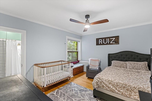126 N Austin Blvd Unit 2N, Oak Park, IL 60302 - bedroom featuring wood finished floors, crown molding, and a ceiling fan