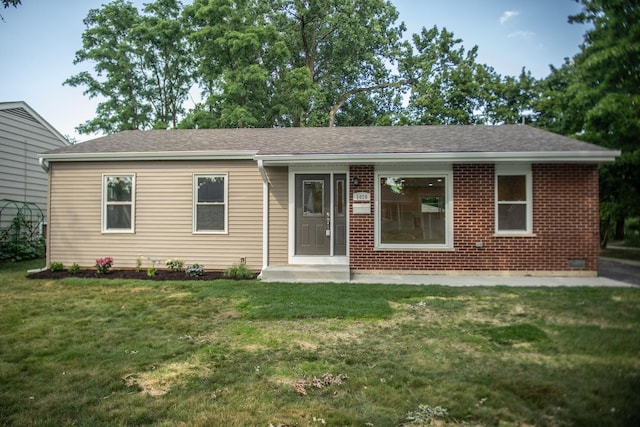 1028 Valley Stream Dr, Wheeling, IL 60090 - ranch-style house featuring a front lawn, a shingled roof, and brick siding