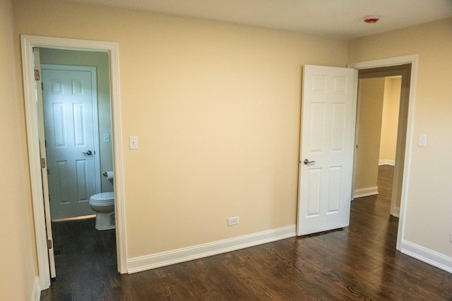 1028 Valley Stream Dr, Wheeling, IL 60090 - unfurnished bedroom featuring dark wood finished floors and baseboards