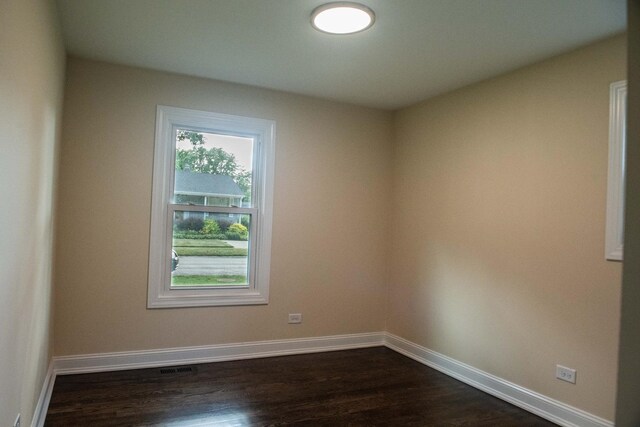 1028 Valley Stream Dr, Wheeling, IL 60090 - empty room featuring baseboards and dark wood-type flooring