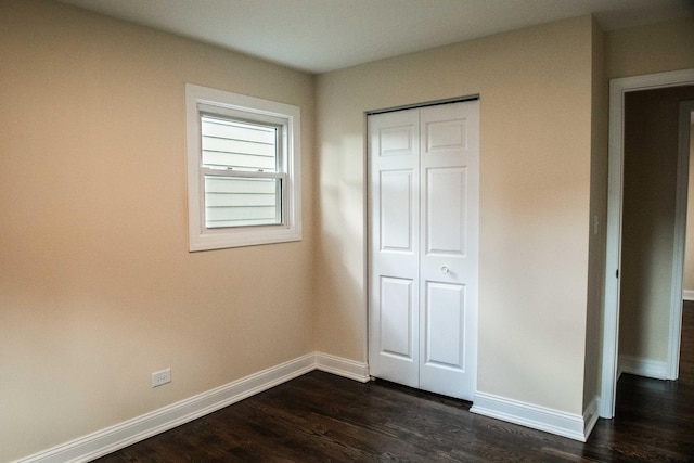 1028 Valley Stream Dr, Wheeling, IL 60090 - unfurnished bedroom with dark wood-type flooring and a closet