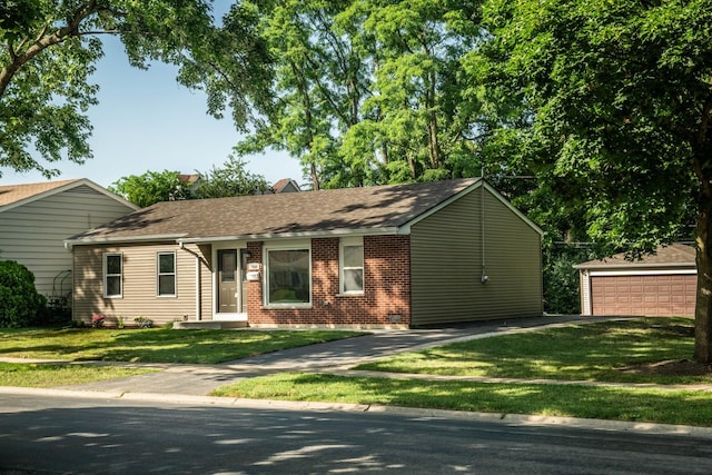 1028 Valley Stream Dr, Wheeling, IL 60090 - ranch-style home featuring a front yard, brick siding, a detached garage, and roof with shingles