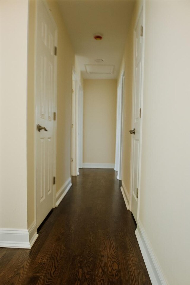 1028 Valley Stream Dr, Wheeling, IL 60090 - corridor with attic access and dark wood-style floors
