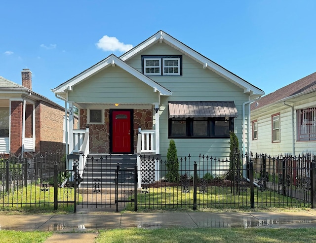 30 E 102nd St, Chicago, IL 60628 - view of front of property featuring covered porch and a fenced front yard