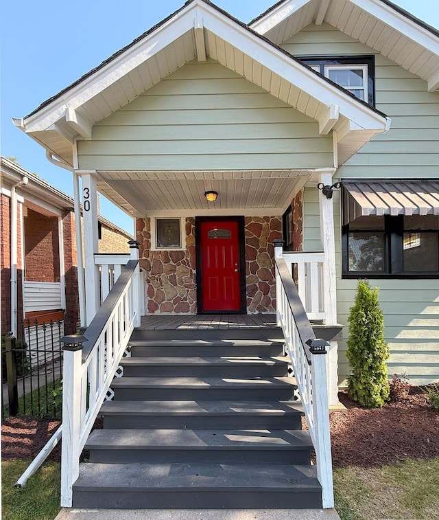 30 E 102nd St, Chicago, IL 60628 - property entrance with stone siding and covered porch