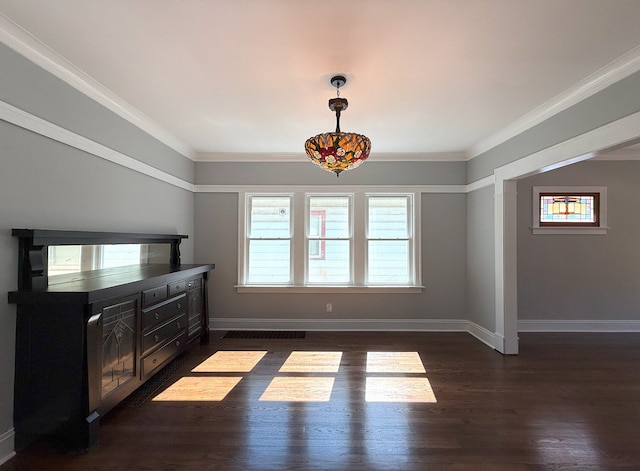 30 E 102nd St, Chicago, IL 60628 - unfurnished dining area with dark wood finished floors and ornamental molding