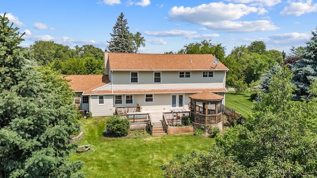 739 Crest Ave, Schaumburg, IL 60193 - back of house with a deck, a yard, and a chimney