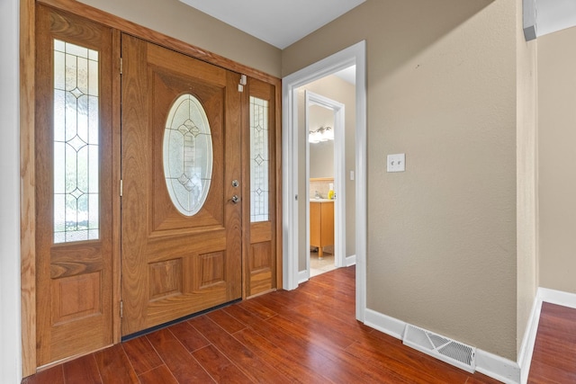 739 Crest Ave, Schaumburg, IL 60193 - foyer featuring baseboards and dark wood-type flooring
