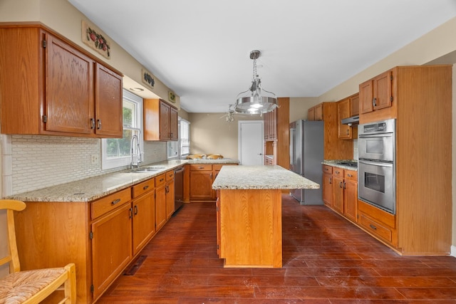 739 Crest Ave, Schaumburg, IL 60193 - kitchen with appliances with stainless steel finishes, decorative backsplash, a center island, dark wood-type flooring, and under cabinet range hood