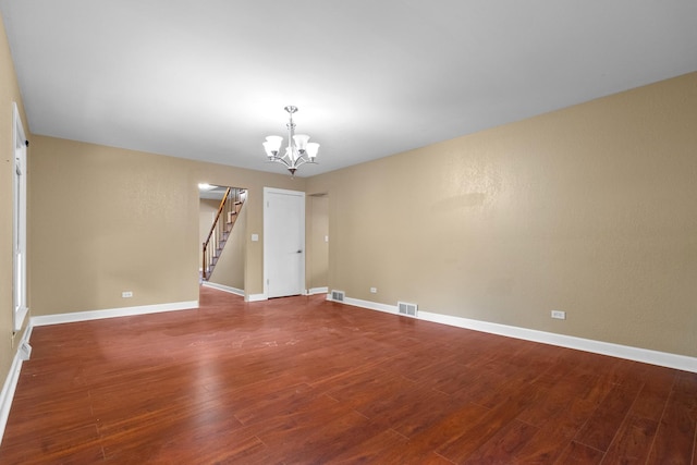 739 Crest Ave, Schaumburg, IL 60193 - spare room with a chandelier, wood finished floors, and stairs