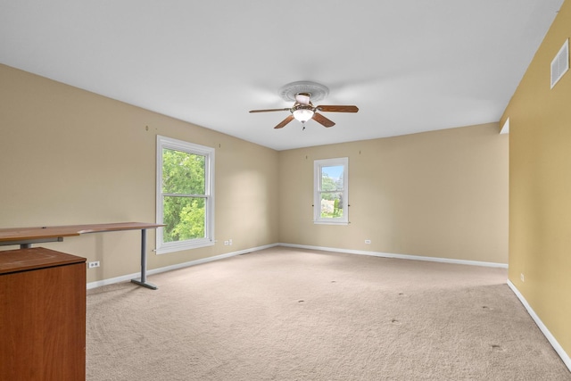 739 Crest Ave, Schaumburg, IL 60193 - empty room with ceiling fan, carpet flooring, and healthy amount of natural light