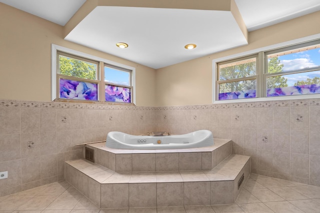 739 Crest Ave, Schaumburg, IL 60193 - bathroom with tile walls, tile patterned floors, a jetted tub, and wainscoting