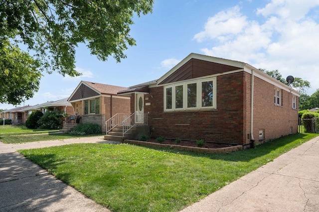7826 S Kenneth Ave, Chicago, IL 60652 - view of front facade featuring brick siding and a front yard
