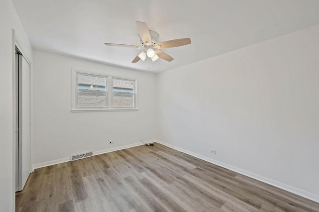 7826 S Kenneth Ave, Chicago, IL 60652 - unfurnished bedroom featuring wood finished floors, a closet, and a ceiling fan