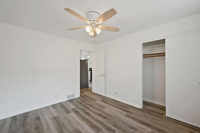 7826 S Kenneth Ave, Chicago, IL 60652 - unfurnished bedroom featuring wood finished floors, a closet, and ceiling fan