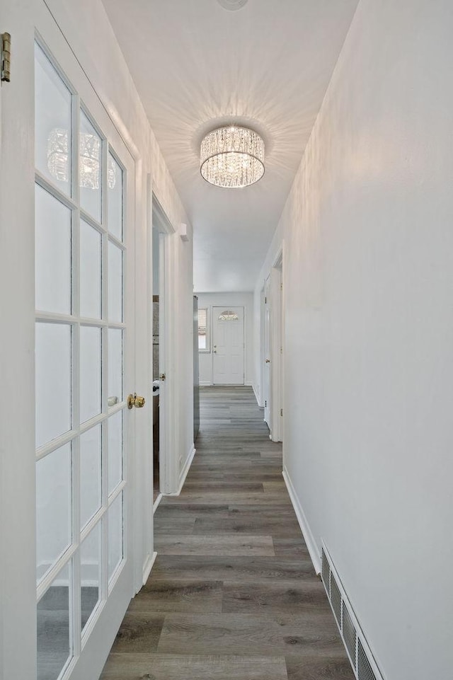 7826 S Kenneth Ave, Chicago, IL 60652 - hallway featuring a chandelier and wood finished floors