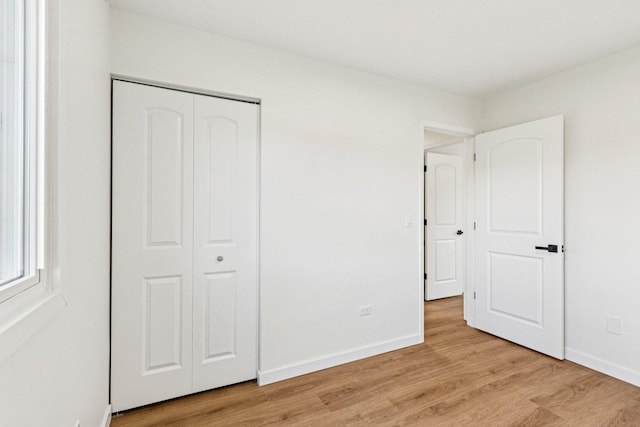 1516 Laguna Ct, Wheeling, IL 60090 - unfurnished bedroom with light wood-type flooring and a closet