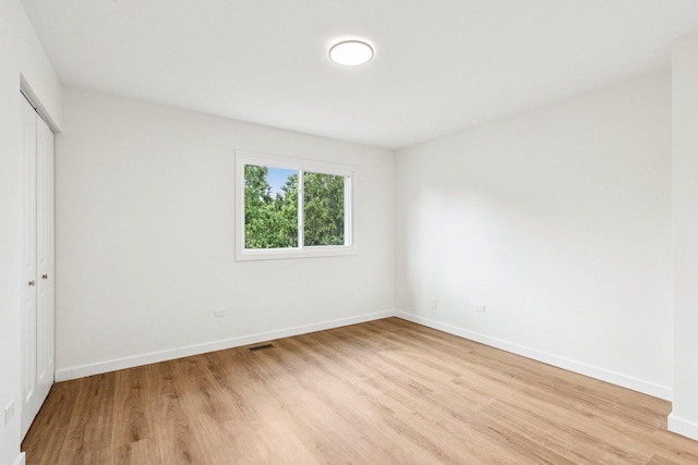 1516 Laguna Ct, Wheeling, IL 60090 - unfurnished bedroom with light wood-style floors and a closet