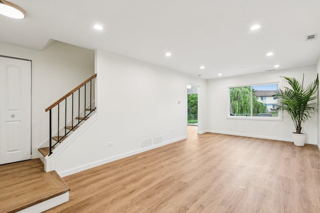 1516 Laguna Ct, Wheeling, IL 60090 - unfurnished living room featuring light wood-style flooring, recessed lighting, and stairway