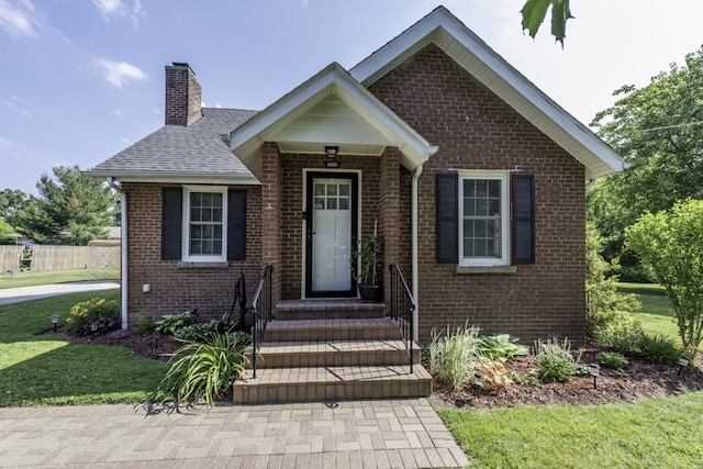 10415 W Ames Ave, Beach Park, IL 60087 - view of front of home with brick siding, a chimney, and a shingled roof